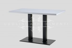 Minimalist table comprising a painted metal base and laminate top